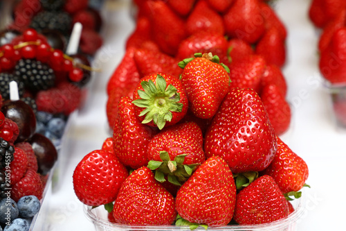 Close up red ripe strawberry on retail display