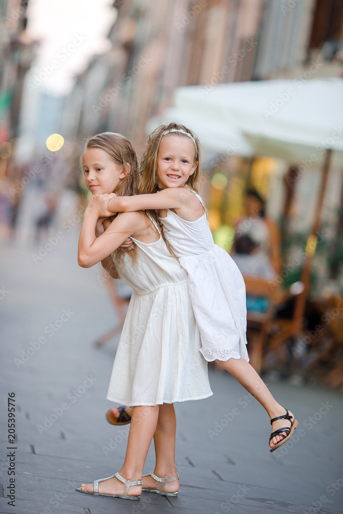 Pretty smiling little girls with shopping bags Pretty smiling little girls with shopping bags