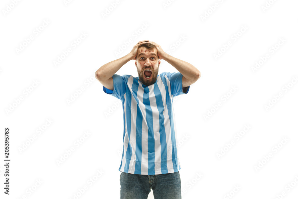 The unhappy and sad Argentinean fan on white background The unhappy and sad Argentinean fan on white background
