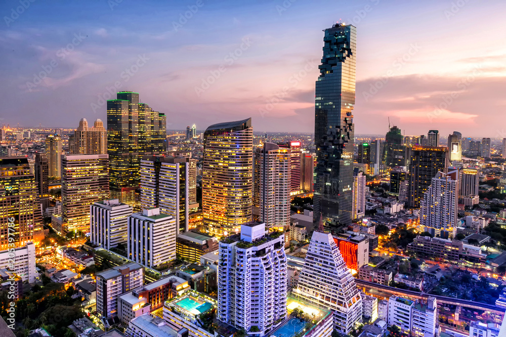 Naklejka premium Modern building in Bangkok business district with beautiful sky at sunset,Bangkok,Thailand.