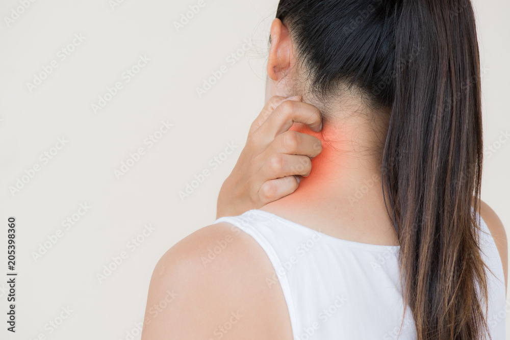 Close up woman hand scratch the itch by hand at neck and back with red highlights. Healthcare and medical concept.