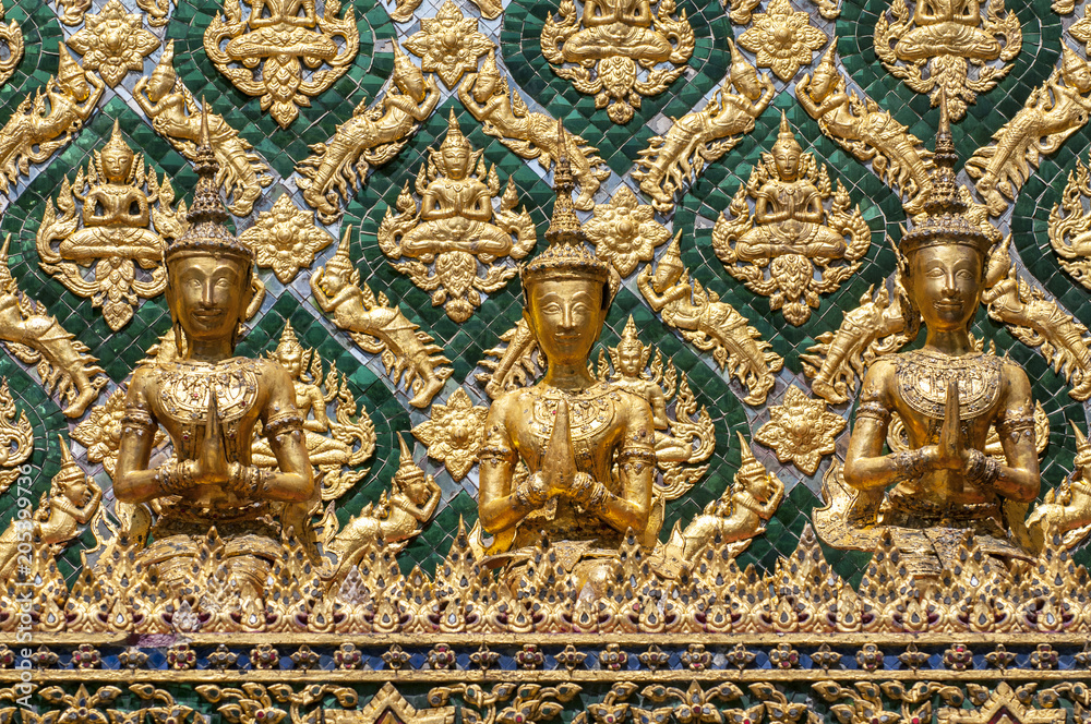 Mosaic encrusted wall of the Phra Mondop library building on the grounds of the Grand Palace Bangkok Thailand. Mosaic encrusted wall of the Phra Mondop library building on the grounds of the Grand Palace Bangkok Thailand.