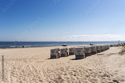 Beach chairs with numbers on a sunny day at the Baltic Sea © kelifamily