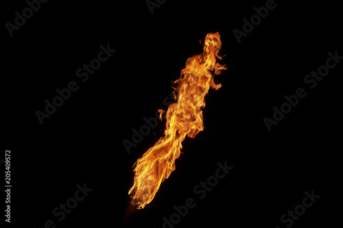 Fire, flame on a black background. Fire for advertising. An unusual game of bright red and yellow colors.