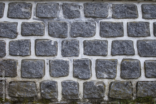Gray stone wall, textured.