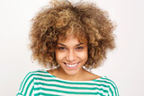 smiling young african woman against white background