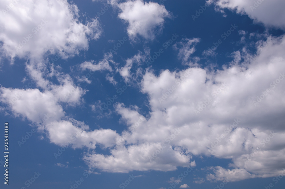 Sun clouds sky during morning background. Blue, white pastel sky, soft sunlight. Abstract blurred blue gradient of peaceful nature. Sun clouds sky during morning background. Blue, white pastel sky, soft sunlight. Abstract blurred blue gradient of peaceful nature.