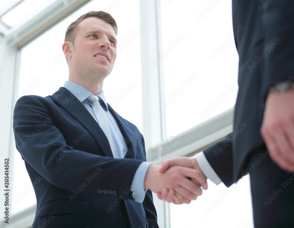handshake of business partners after a favorable trade deal handshake of business partners after a favorable trade deal