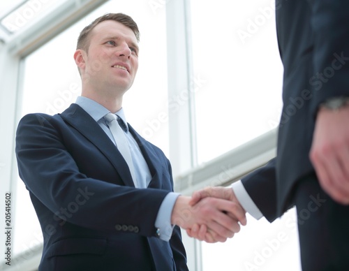 handshake of business partners after a favorable trade deal © ASDF