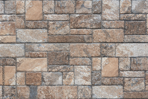 Seamless texture of brown stone - Stone tile floor paving fragment. photo