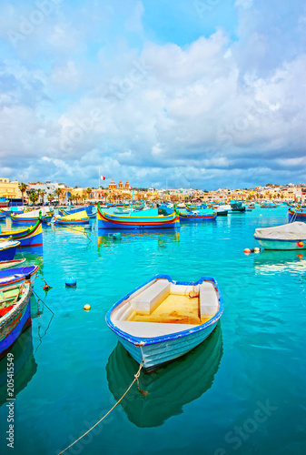 Luzzu boats in Marsaxlokk harbor bay Mediterranean sea Malta © Roman Babakin
