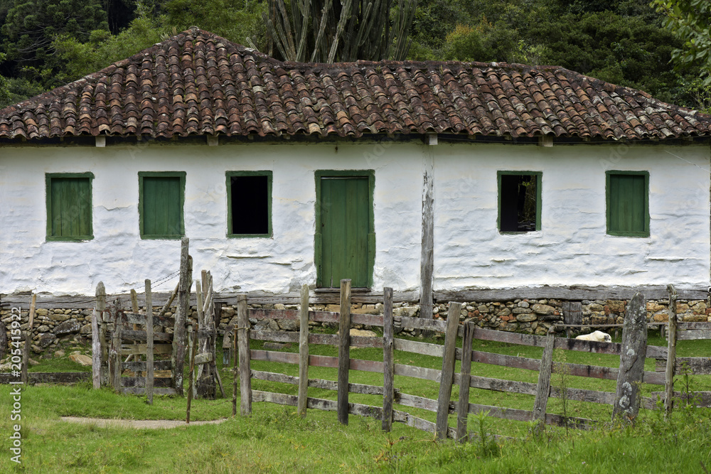 Old settler house in green landscape Old settler house in green landscape