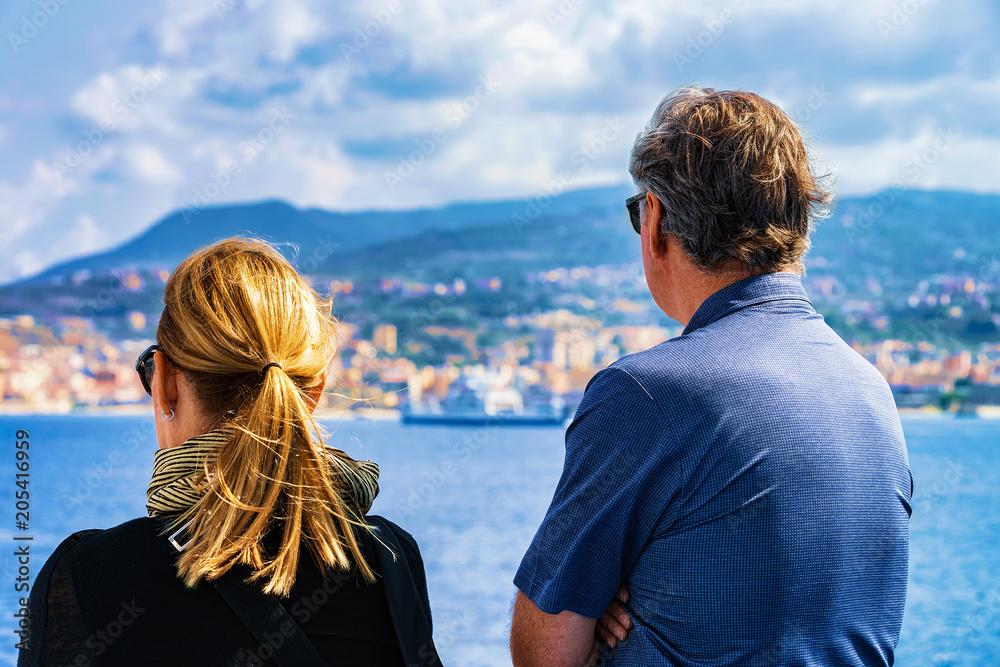 Couple looking at Mediterranean Sea and landscape Reggio Calabria