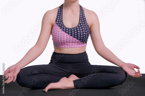 young woman practicing yoga To strengthen the shape of meditation strength in the whtie background