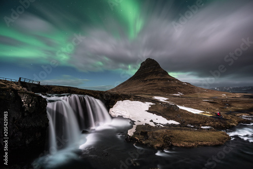 Aurora Borealis exploded on the mountain at Kirkjufell one of the most famous landmark in Iceland / Landscape photography