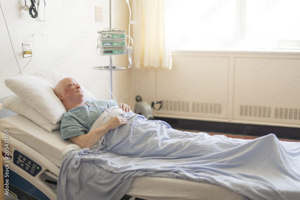 woman in hospital bed suffering from cancer