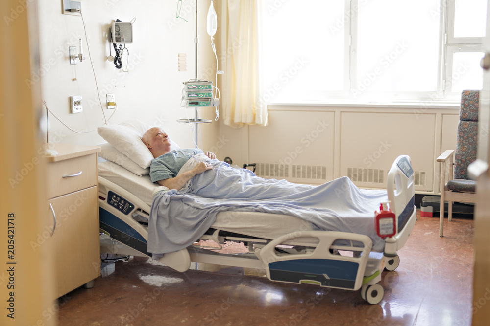 woman in hospital bed suffering from cancer woman in hospital bed suffering from cancer