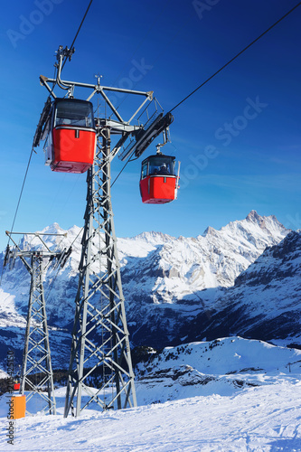 Cable car cabins on winter sport resort Swiss Alps Mannlichen