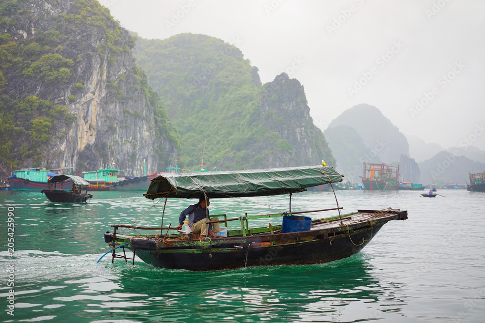 Fishing boat in Ha Long Bay Vietnam Asia