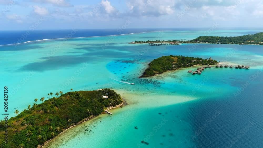 Aerial view of tropical paradise of Bora Bora island, crystal clear water of scenic turquoise blue lagoon - South Pacific Ocean, French Polynesia, 4k UHD Aerial view of tropical paradise of Bora Bora island, crystal clear water of scenic turquoise blue lagoon - South Pacific Ocean, French Polynesia, 4k UHD