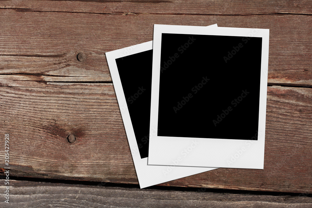 Retro realistic blank instant photo on wooden background. Retro realistic blank instant photo on wooden background.