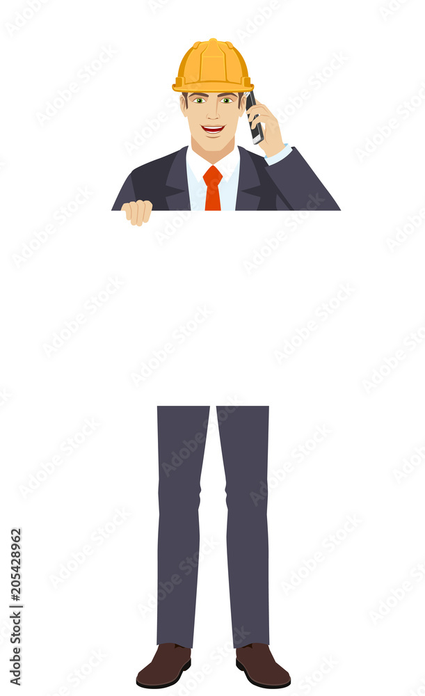 Businessman holding white blank poster and talking on the mobile Businessman holding white blank poster and talking on the mobile
