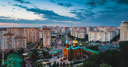 Dronelaps. Aerial view of the evening city of Krasnodar in Russia. Sunset. Time Lapse Day to Night photo