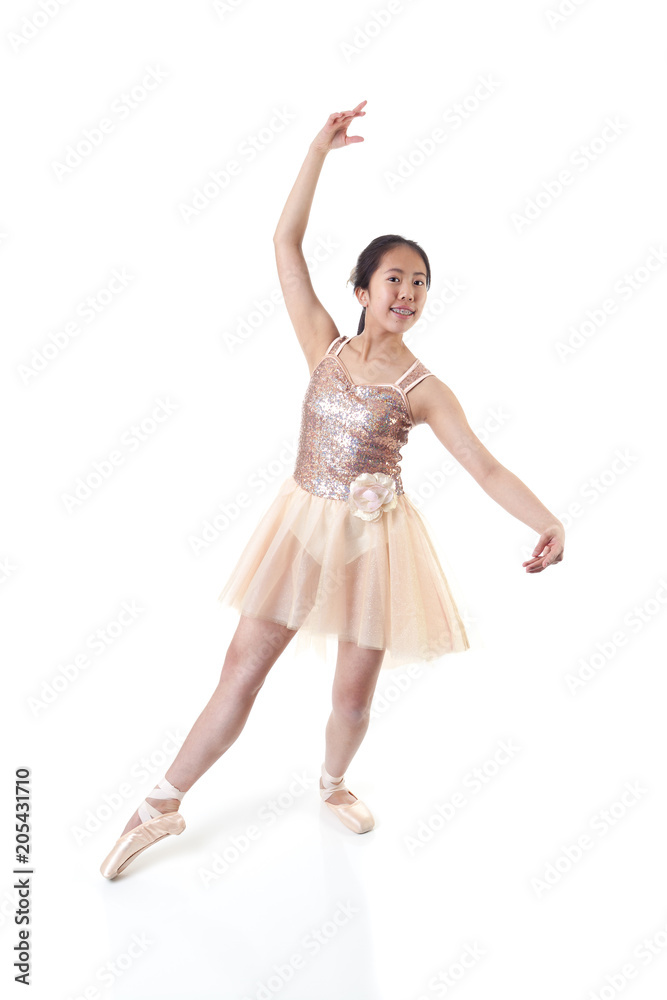 Young Ballerina Making a Ballet Pointe Movement Young Ballerina Making a Ballet Pointe Movement