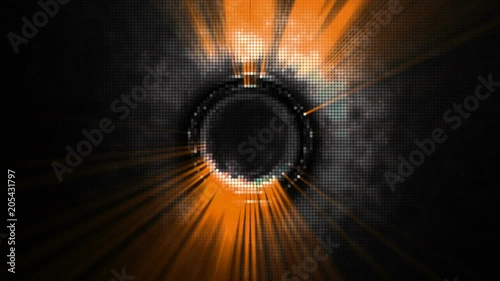 Orange rays of light rotating in a dark background