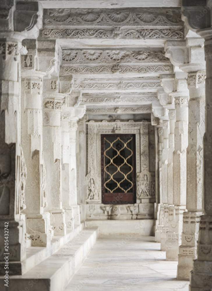 Fototapeta premium Ancient Architectural Ornament, Stone Carving Decorations Inside Ranakpur Jain Temple in Rajasthan, India
