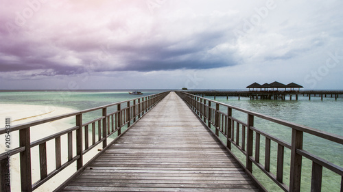 Wooden Beach Dock or Wooden Pier at Beautiful Tropical Beach © Hermiadi