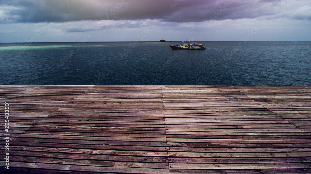 Wooden Beach Dock or Wooden Pier at Beautiful Tropical Sea