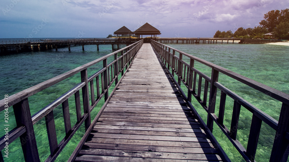 Wooden Beach Dock or Wooden Pier at Beautiful Tropical Beach