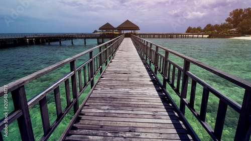 Wooden Beach Dock or Wooden Pier at Beautiful Tropical Beach