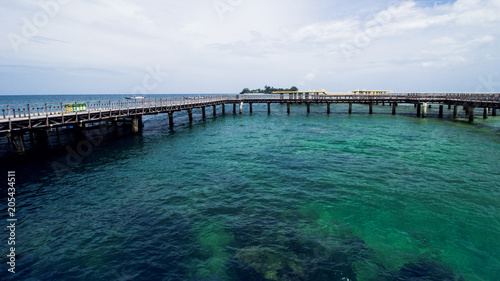 Wooden Beach Dock or Wooden Pier at Tropical Beach © Hermiadi