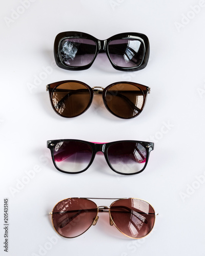 Collection of fashion elegance sunglasses on white background.