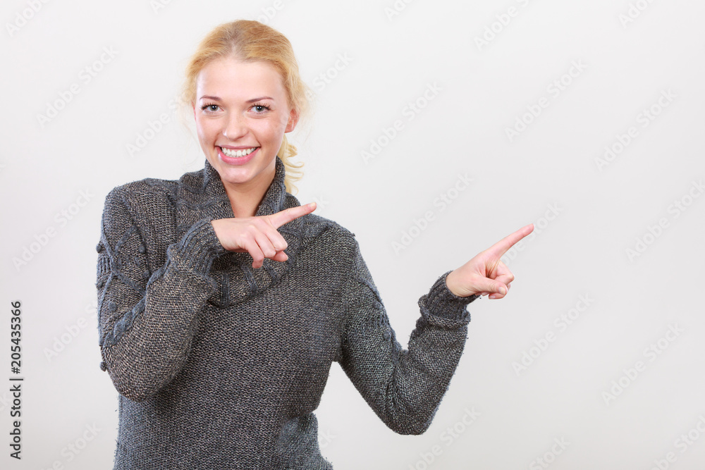 Happy woman pointing on right side Happy woman pointing on right side