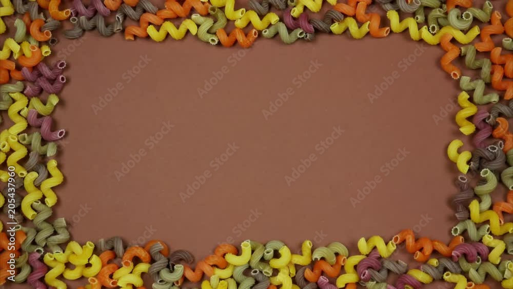 A frame of colored pasta. Italian pasta background. Stop motion A frame of colored pasta. Italian pasta background. Stop motion