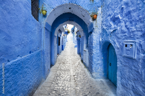 street tunnel between blue walls in old city in Morocco © sergejson