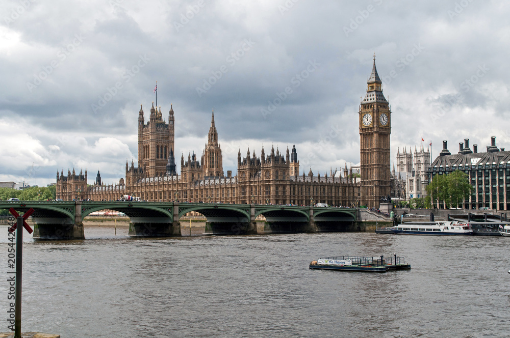 The British Parliament, and the Big Bens clock at the Thames River in Westminster (London, United Kingdom)