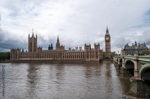 The British Parliament  and the Big Bens clock at the Thames River in Westminster - London  United Kingdom