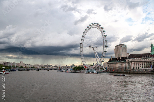 View of the River Thames, the London Eye, and the Parliament in Westminster - London, United Kingdom