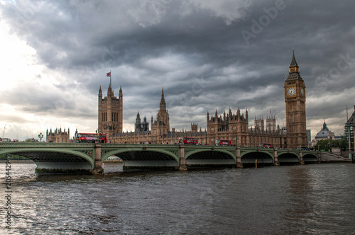 The British Parliament, and the Big Bens clock at the Thames River in Westminster - London, United Kingdom