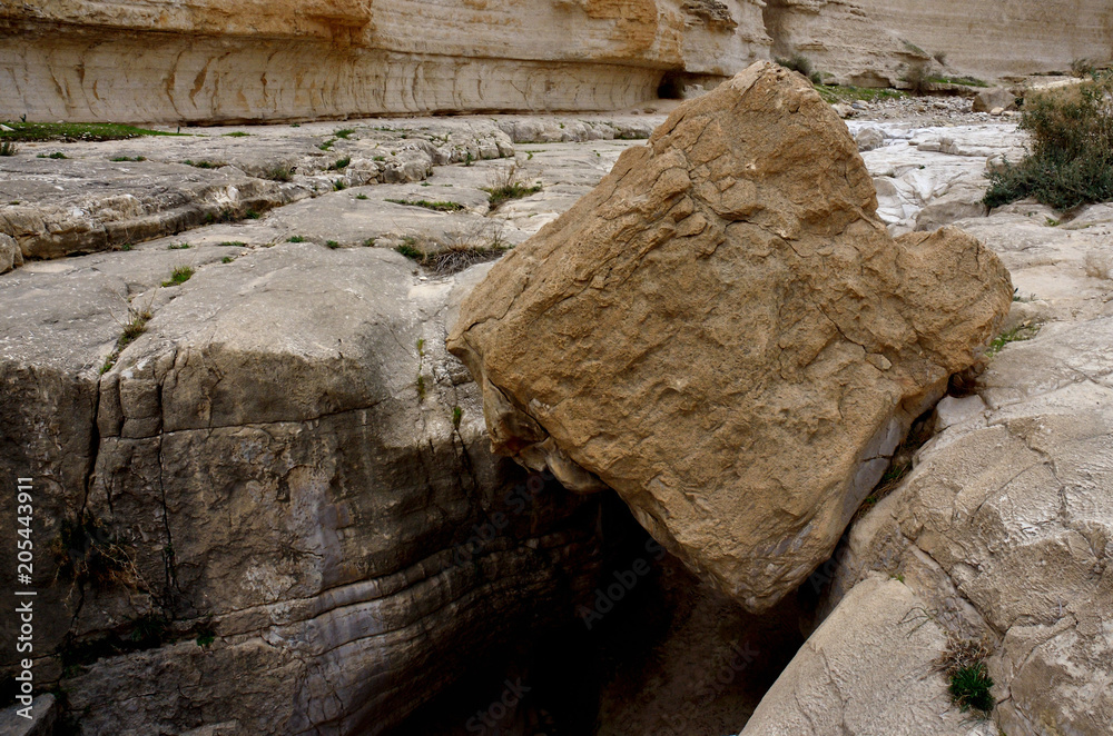Big cube stone in Nahal Darga canyon ,Judean desert, Israel, famous natural landmark