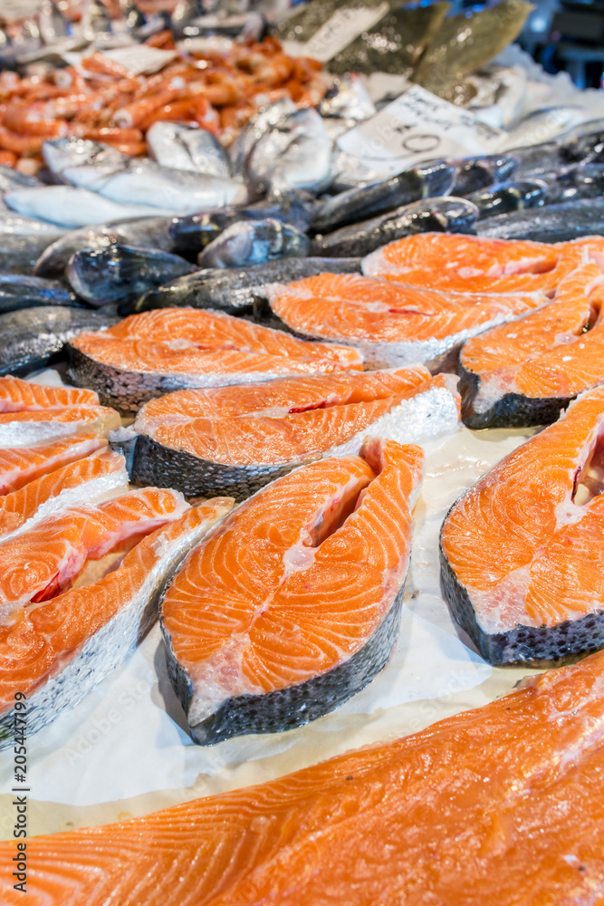 Fresh salmon steaks on ice for sale at italian fish market Fresh salmon steaks on ice for sale at italian fish market