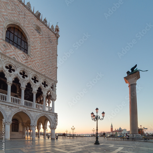 Outdoor cafe near the Palace of doges on the San Marco square at the sunrise in Venice, Italy