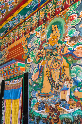 Gangtok, India - May 2, 2017: Mural paintings in the buddhist Rumtek monastery temple in Gangtok, India