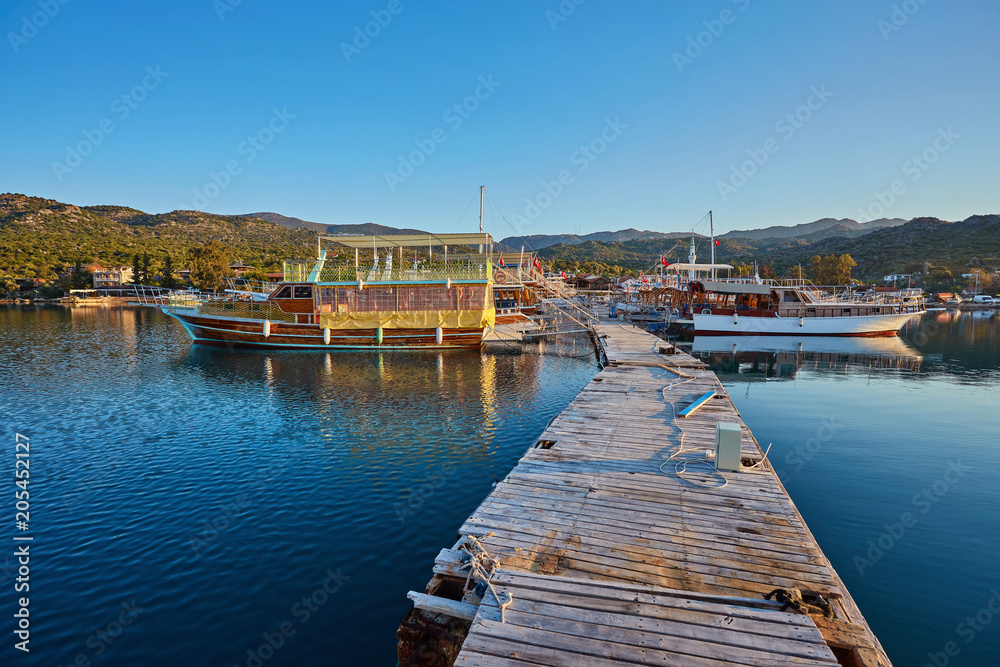 Fototapeta premium Marine parking of boats and yachts in Kekova is a sunken city in Turkey.