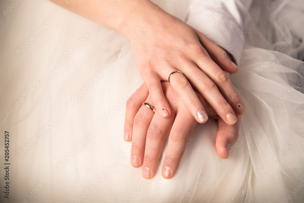 Hands of just married bride and groom with rings. Wedding photograph Hands of just married bride and groom with rings. Wedding photograph