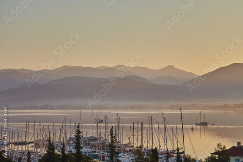 Beautiful Sunset and sailing yachts in Fethiye Harbour photo